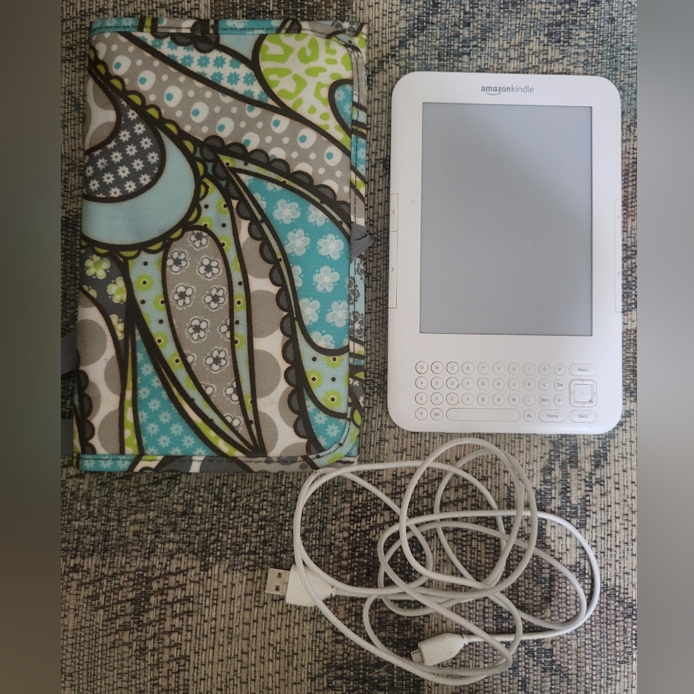 Amazon Kindle with charging cord and Thirty-one carrying case